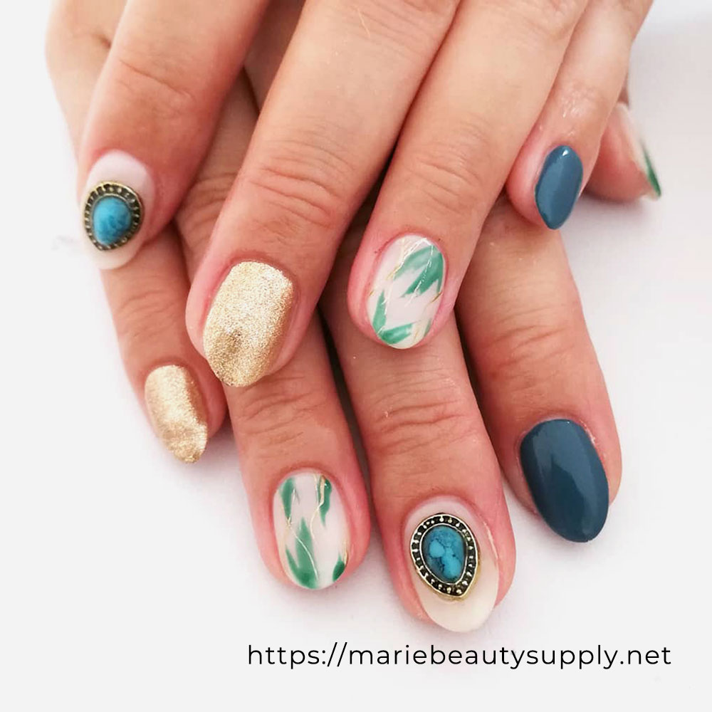 Exotic Nails with a leaf-like Nuance Nail Accent. Nail Art Gallery by MARIE BEAUTY SUPPLY.