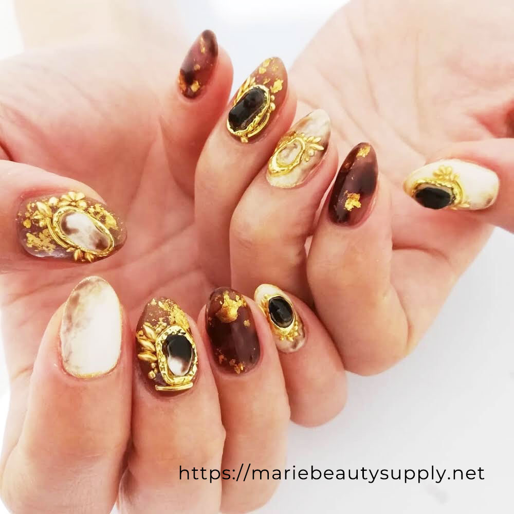 Gorgeous Nail Design With Gold on Brown and Ivory Base.