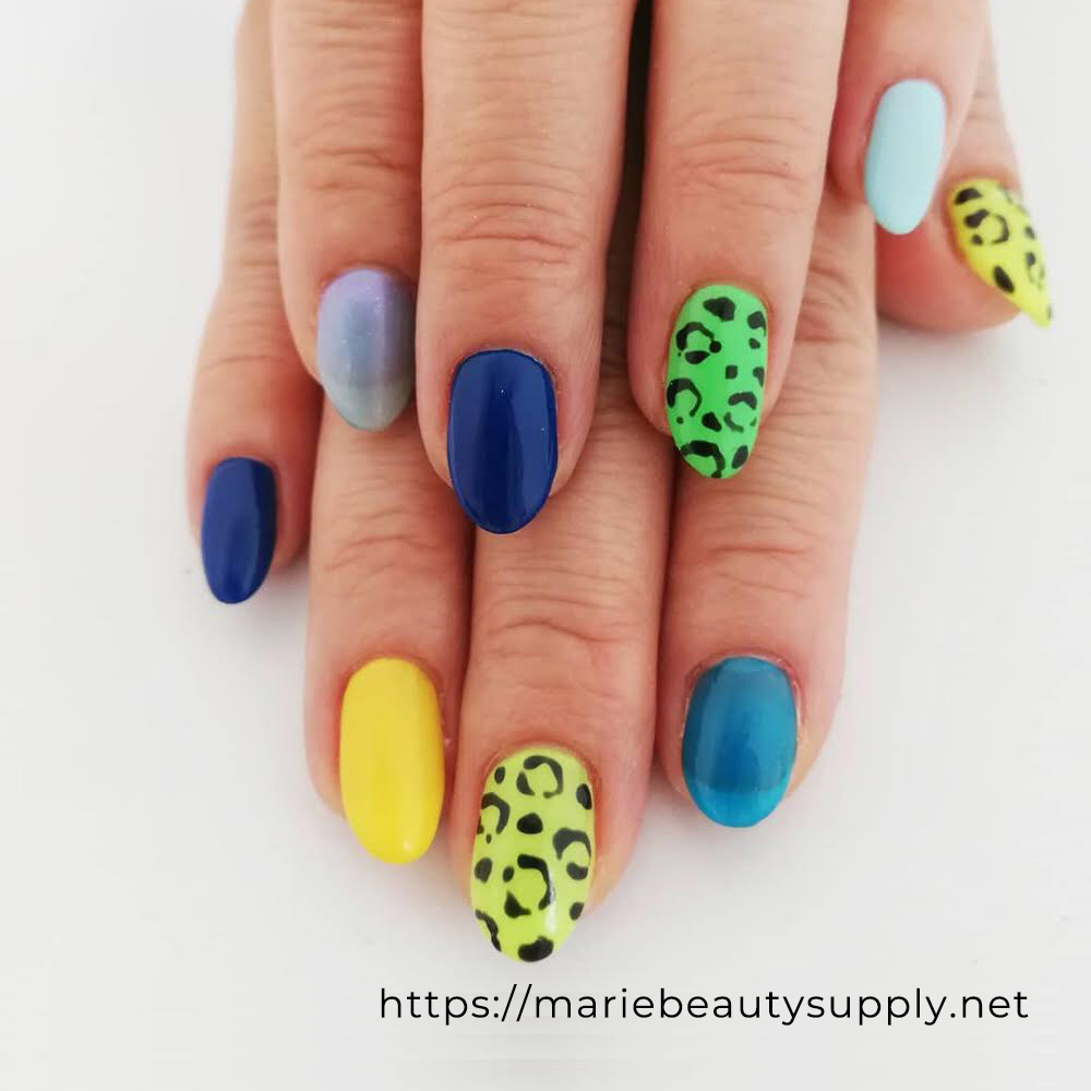 Leopard Design Nails Using Various Shades of Blue and Green.