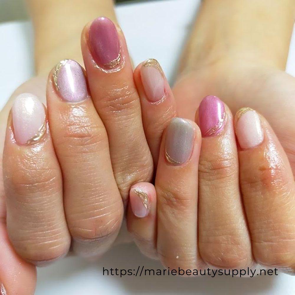 Gorgeous Pink Nails with Gold Accents.