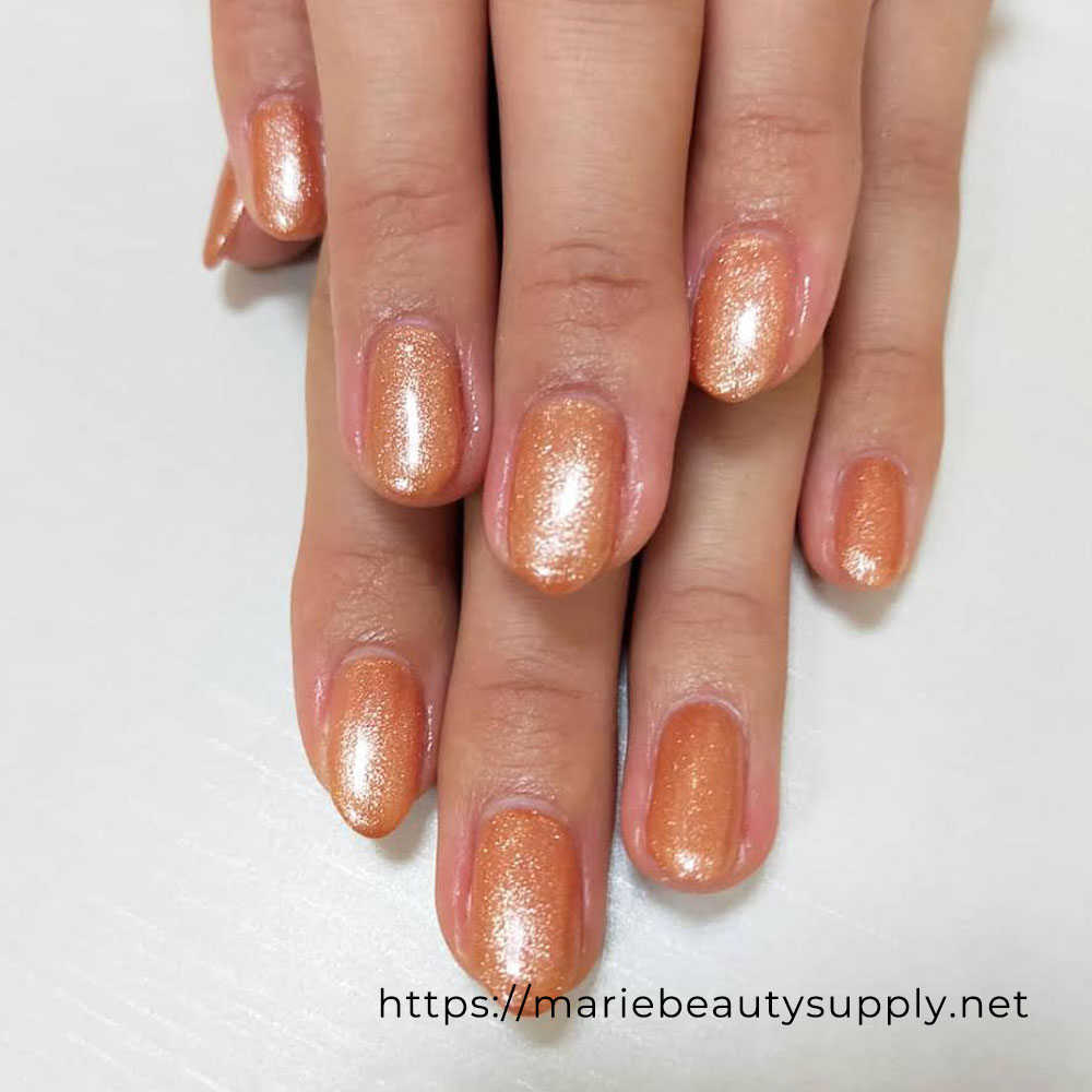 Orange Glitter Nails.