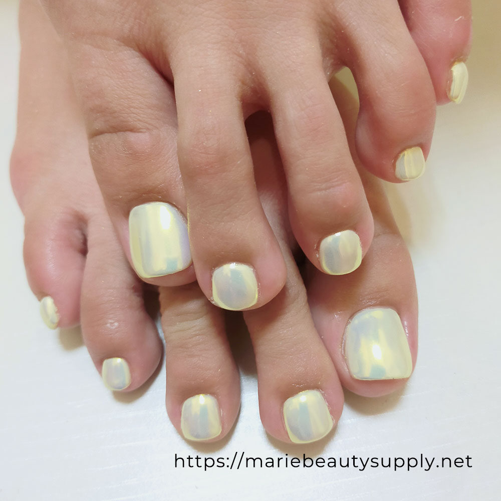 Pedicure with yellow mirror powder layered with yellow